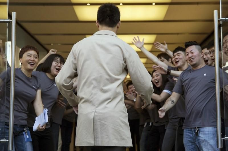 The first customer at an Apple Store in Beijing. | Image Credit: Reuters