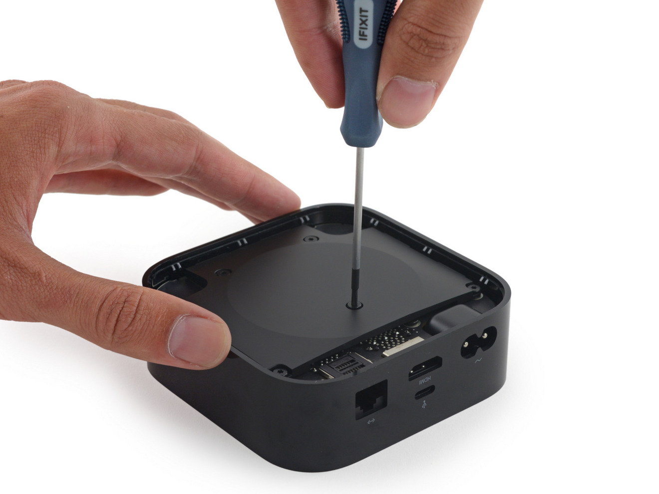 Fourth generation Apple TV disassembly by iFixit, showing similar screw position