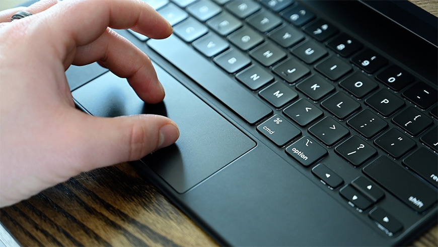 Inside the glass trackpad is a single button with a lever system that clicks evenly anywhere you press