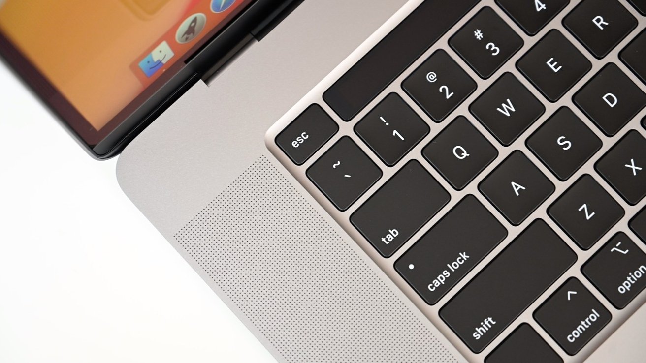 The physical escape key and Touch Bar