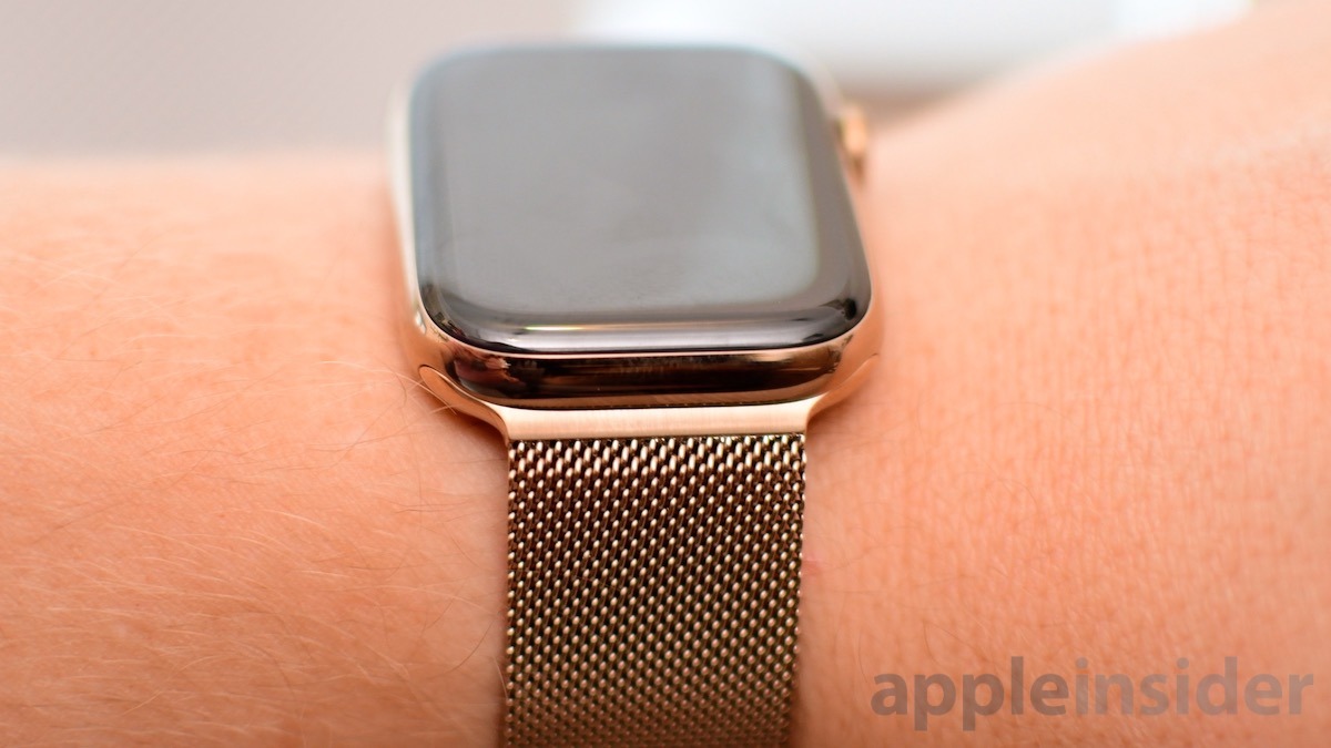 Black apple watch shop with gold milanese loop