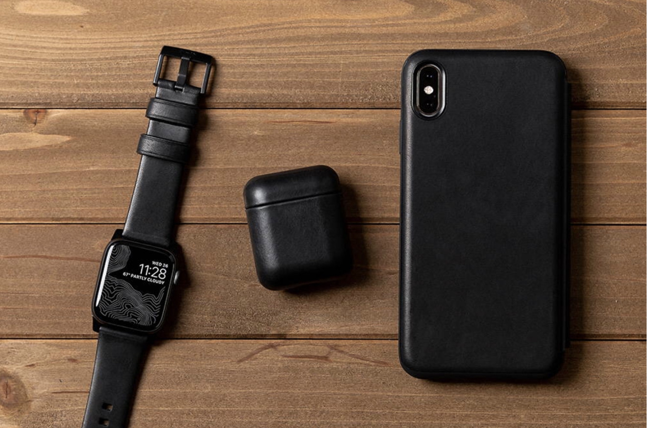 Nomad Modern Apple Watch Strap, AirPods Rugged Case, and iPhone Rugged Case in black