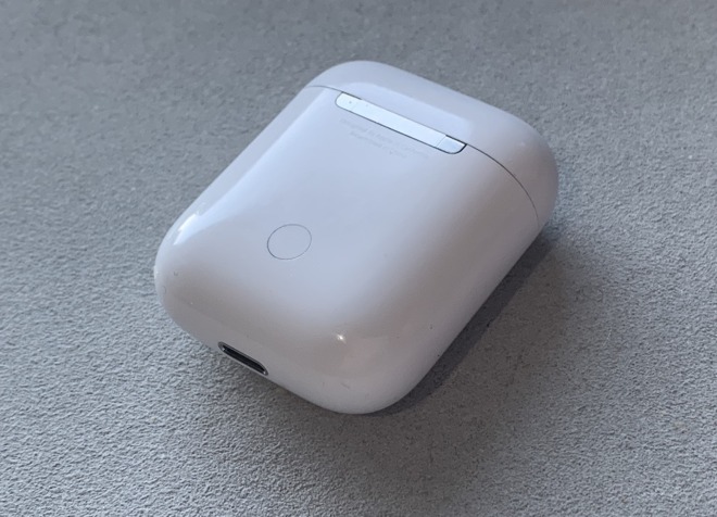 There's a small reset button on the rear of the AirPod charging case