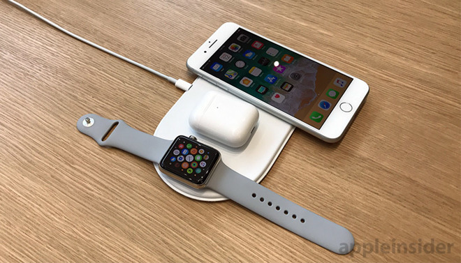 An Apple illustration of a wireless charging AirPods case on the unreleased AirPower charging mat