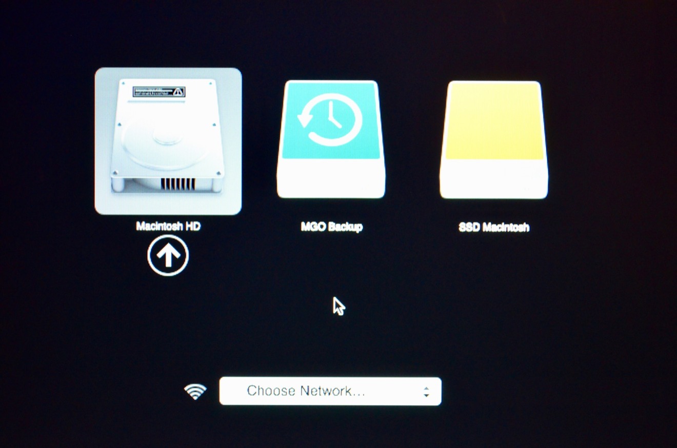 The boot drive selection screen of the Mac mini, showing the original drive, a Time Machine drive, and the replacement SSD