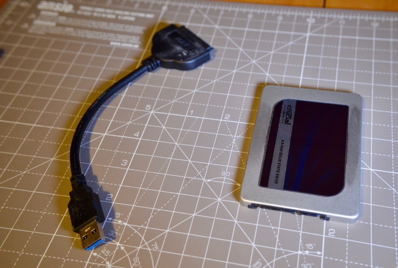 The new SSD and the USB-to-SATA cable for data transfers