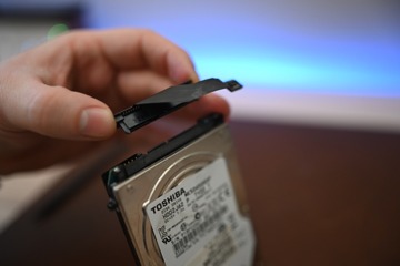 The SATA connector can be attached to the new drive without Apple's tape