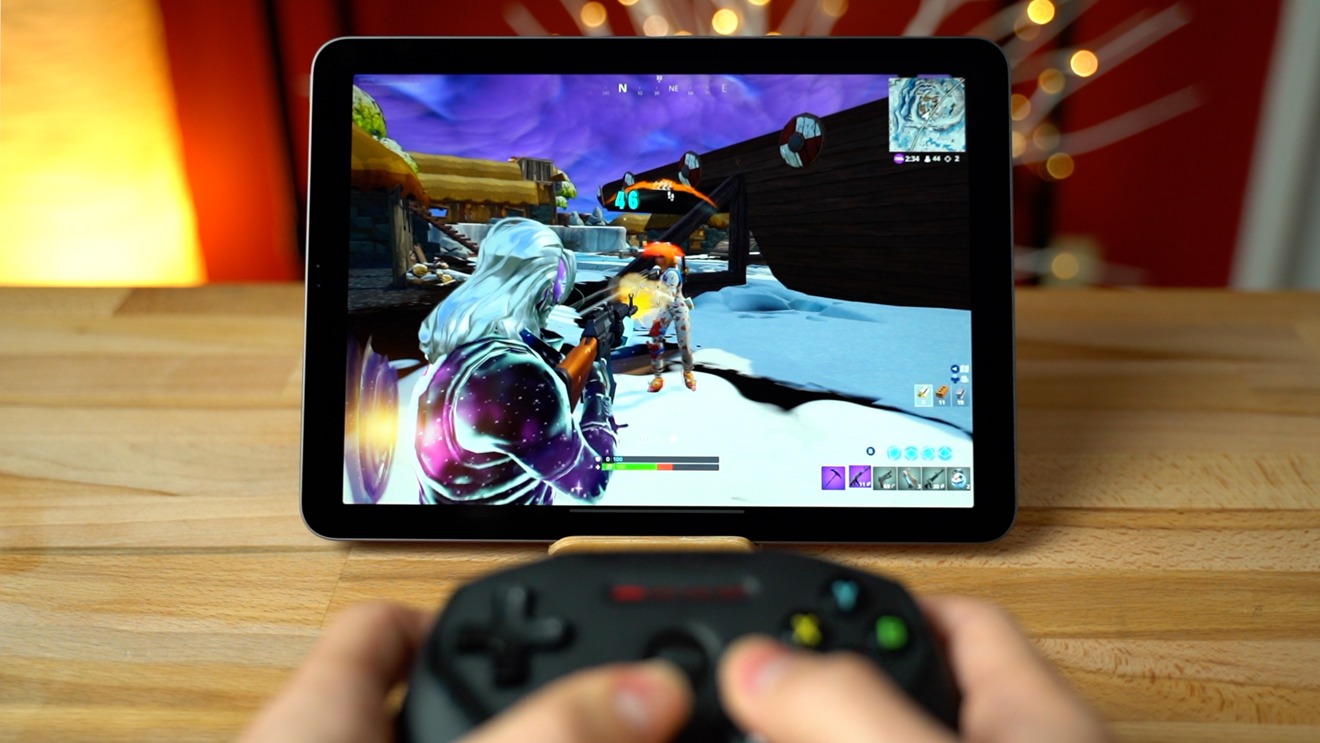 Playing 'Fortnite' on an iPad Pro and iPhone XR with a controller is a