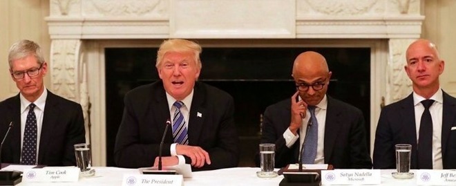 Cook sitting next to President Trump at an early White House meeting