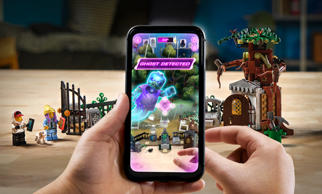 The accompanying AR app shows the 'haunted' version of the physical Lego playset