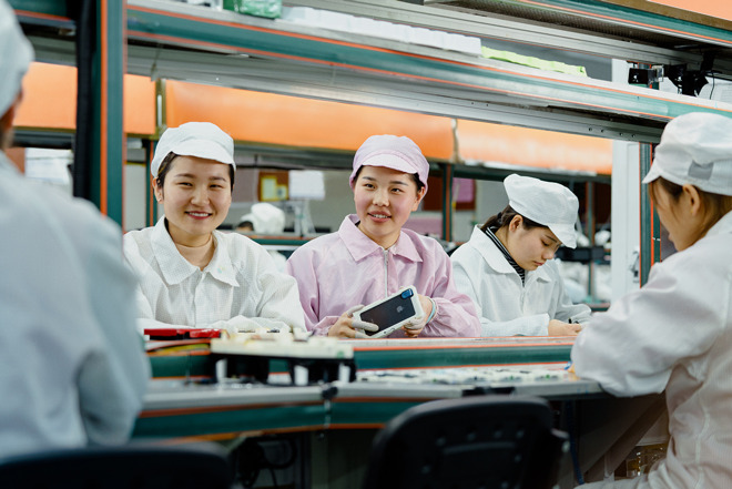 Line operators at an iPhone production facility in China awarded the Green Factory designation.