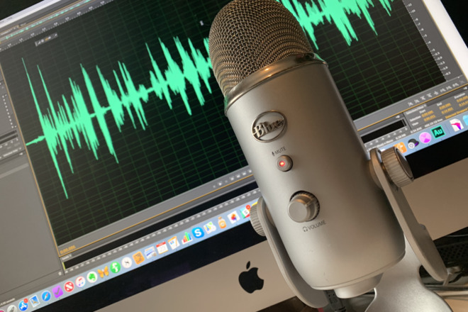 A Blue Yeti microphone in front of a Mac