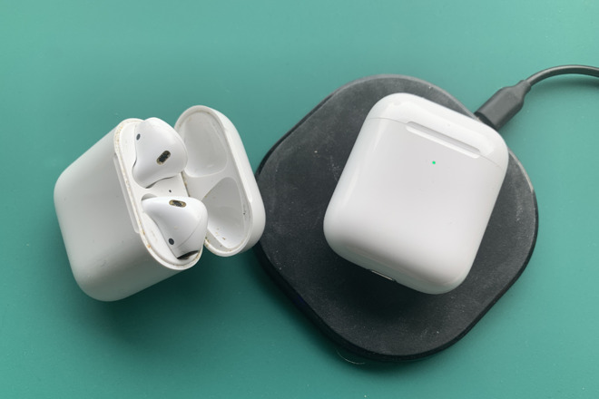 Right: shiny new AirPods 2 on a wireless charging mat. Left: forlorn and abandoned AirPods 1.