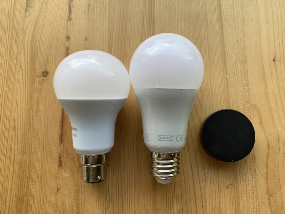 Ikea's bulbs (right) are taller than Phillips Hue ones (left). Notice the old-style bayonet cap on the bottom of the Hue. Phillips sells both bayonet and screw-fit bulbs. Ikea only makes screw ones, but does sell adaptors.