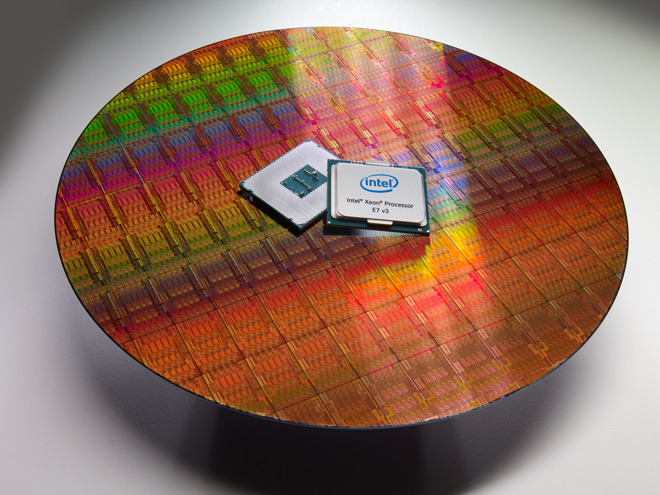 An example of a wafer used to produce Intel's Xeon E7 processor in 2015, with the processor itself for scale.