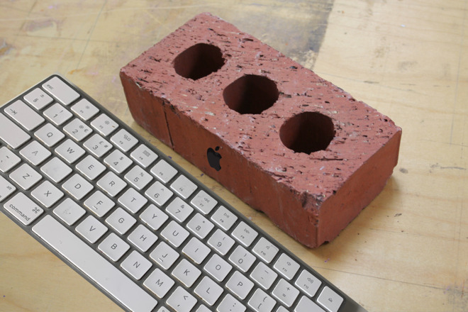 Photo: keyboard and Apple logo by William Gallagher. Brick by Andrew Lister