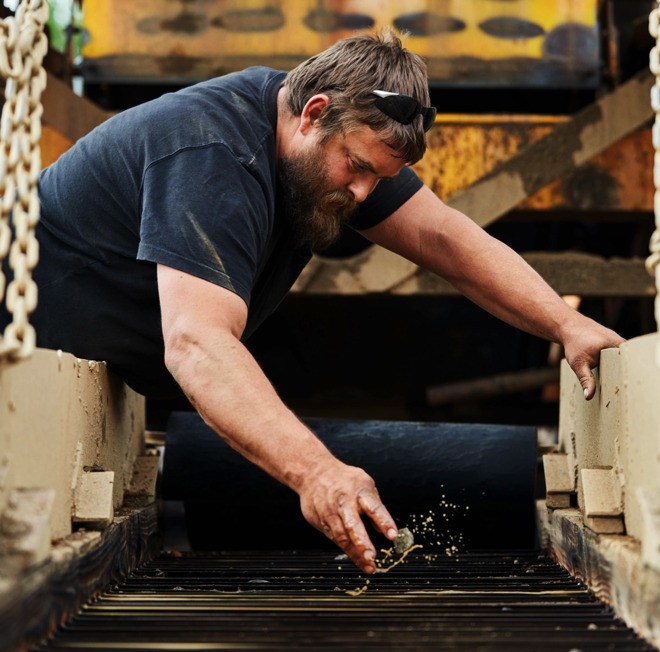 Chris Race, Dean Race's son, working a tailing pile looking for gold