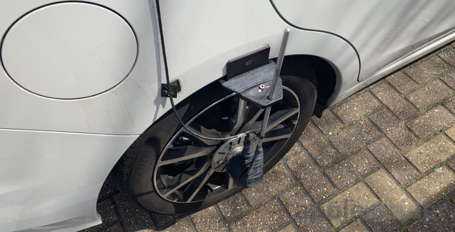 Detail of the sensors attached to the wheels on an Apple Maps car