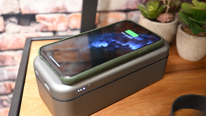 An 8000mAh battery is built into the lid with a 10W Qi charger, USB-C PD, and USB-A outputs