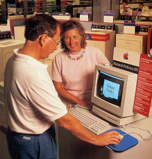 A Sears store selling a Macintosh Performa back in the day. Are those washing machines behind them?