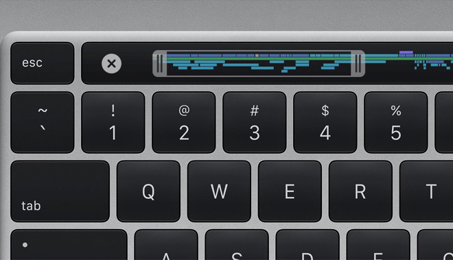 A redesigned keyboard has a dedicated escape key, Touch ID sensor, and an inverted 'T' for arrow keys