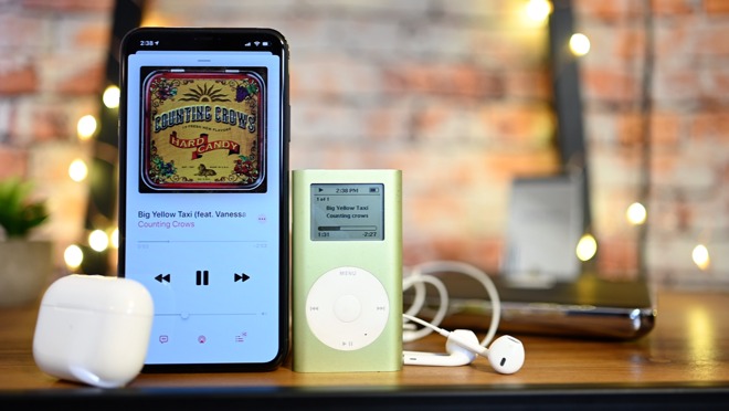 An iPhone 11 Pro Max with AirPods next to our iPod mini with wired earbuds