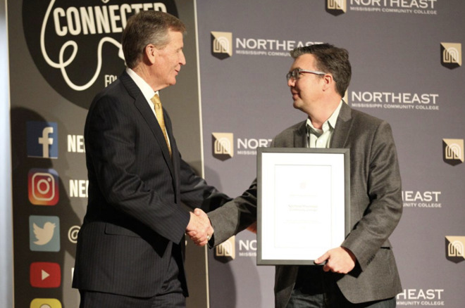 NEMCC President Ford accepting award from Apple's Jon Landis (photo credit Daily Journal)