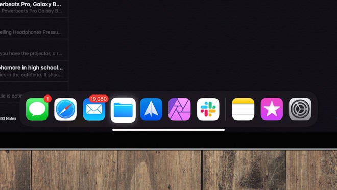Drag the cursor to the bottom to access the Dock within apps