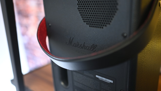 A velvet-lined strap is atop to array the nearly 11 pound speaker