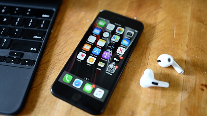 The new iPhone SE next to AirPods Pro and the Magic Keyboard for iPad Pro