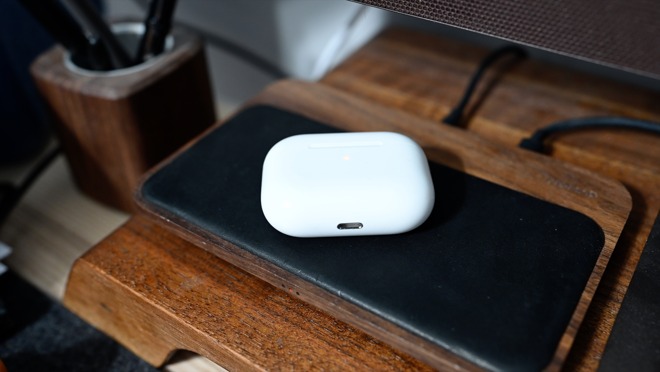 AirPods Pro on the Nomad wireless Base Station next to Grovemade pencil cup