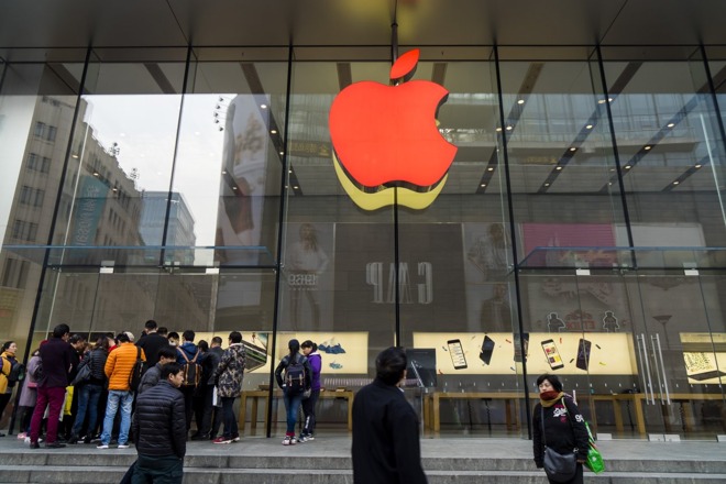 An Apple Store in China with its logo illuminated for World AIDS Day. Credit: Wang Gang