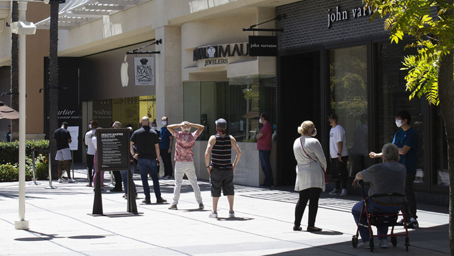 A line forming outside of Apple Fashion Valley in San Diego, Calif.