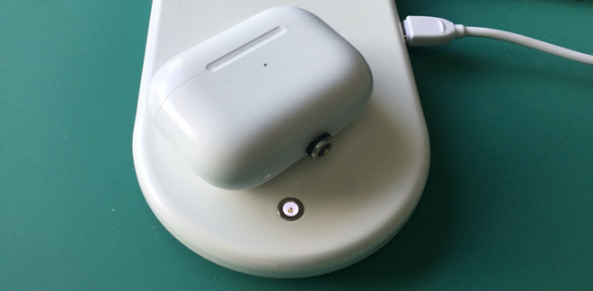 You have to fit an adaptor to the AirPod charging case to use it on the pad's connector. However, you can also charge wirelessly by placing it where the phone usually goes.