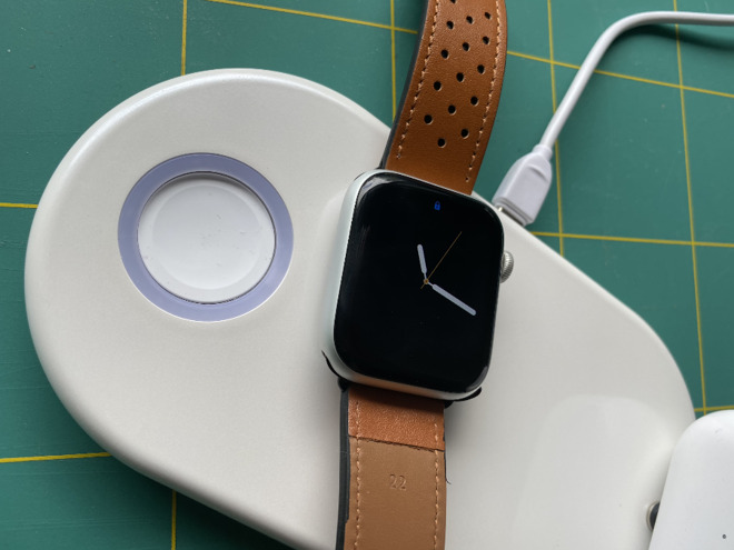 The Apple Watch charging part (left) is loose, but it snaps up when you place the Watch on it