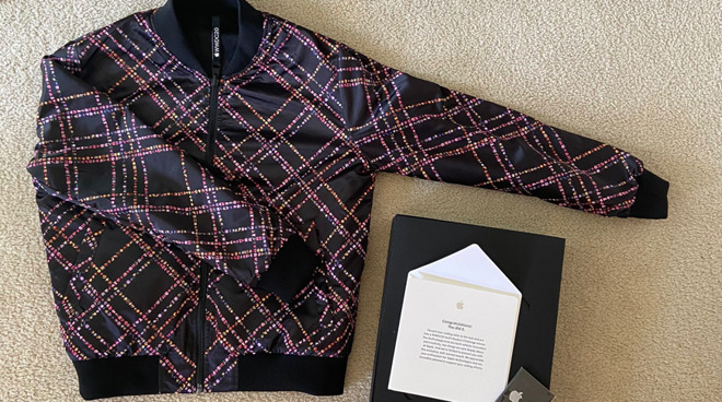 The jacket, pins, and congratulations card from Apple that Swift Student Challenge winners are now receiving