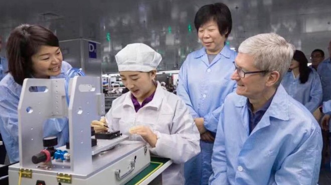 Apple CEO Tim Cook visiting a Luxshare factory producing AirPods in 2017