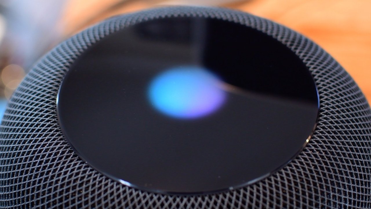 The touch-sensitive glass surface of the HomePod top