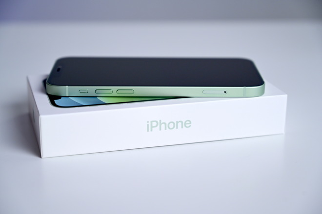 Green iPhone 12 on its new box