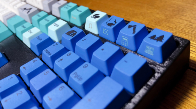 Dark blue key caps with black characters can be hard to read in low light
