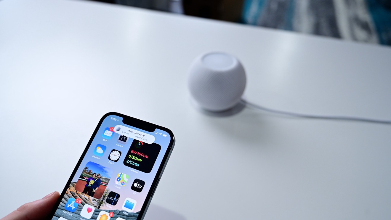 Your phone will vibrate and the HomePod will glow brighter as your phone approaches