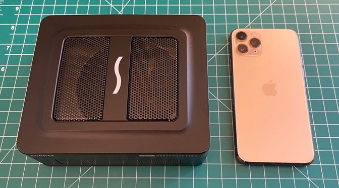 The Sonnet Breakaway Puck is very tightly packed, with a fan in the top (iPhone 11 Pro for scale)