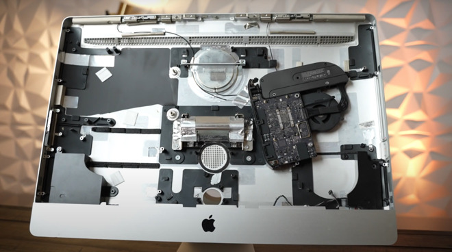 The Mac mini is held in via one screw inside the iMac