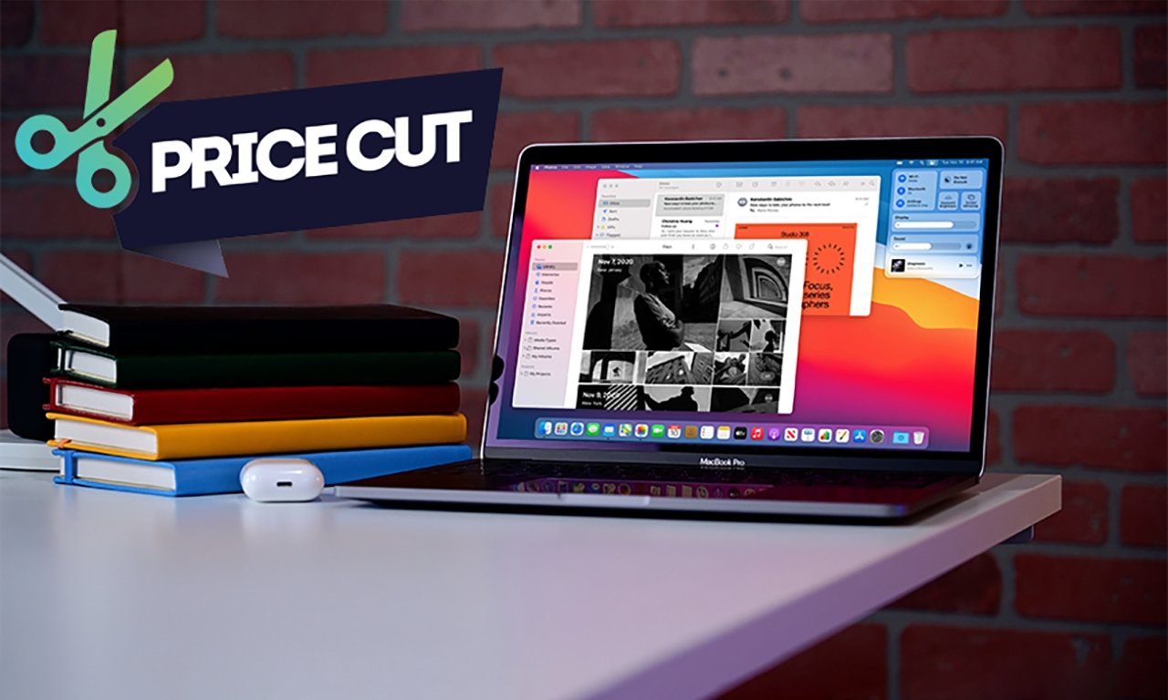 Apple MacBook Pro 13 inch on table beside AirPods and books with price cut graphic