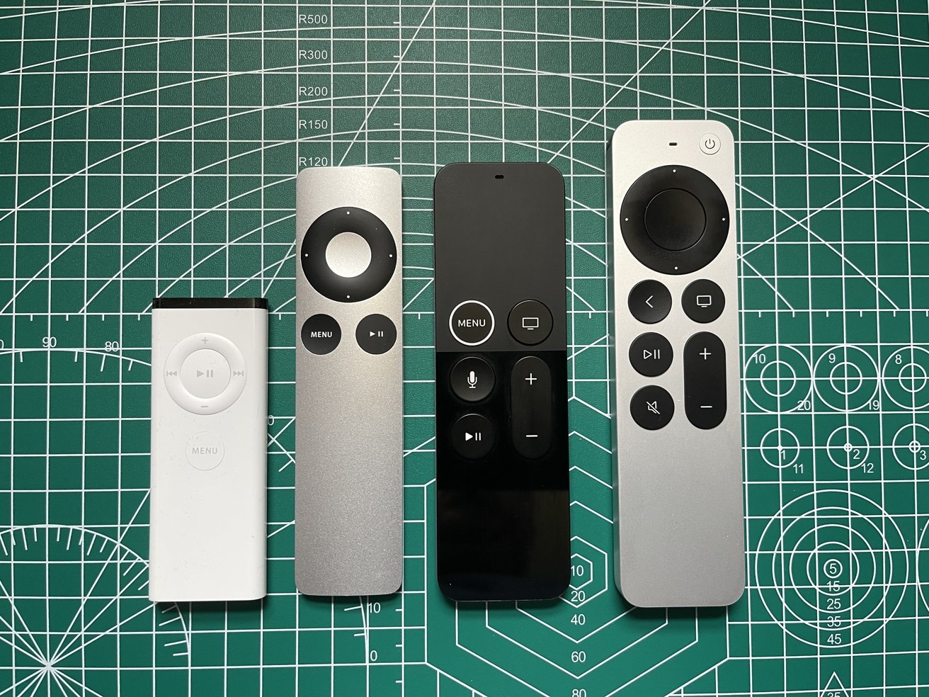 The first Apple Remote (First from the left), the second Apple Remote, the refreshed first-generation Siri Remote, the second-generation Siri Remote.)