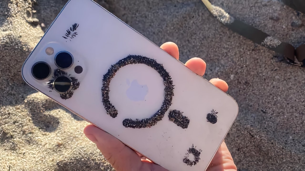 Ferrous sand attracted to the magnetic portions of an iPhone 12