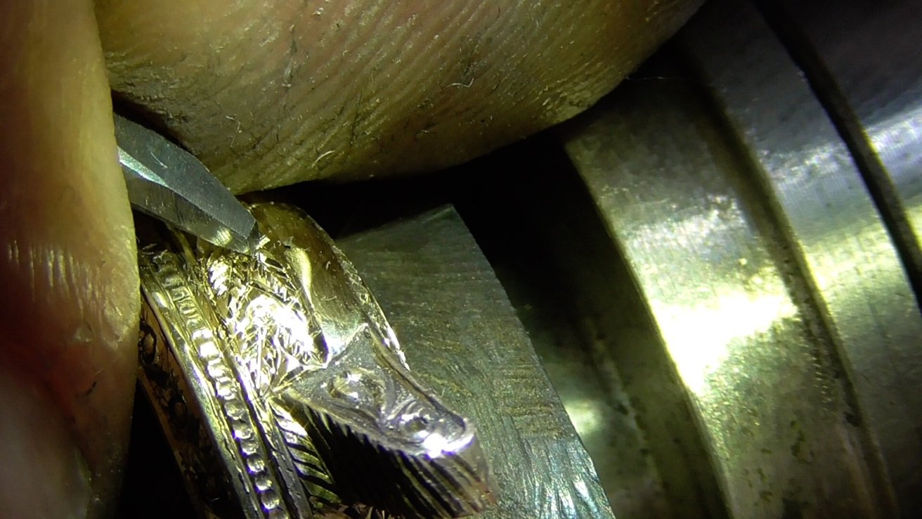 All of the engraving on this gold Apple Watch is done by hand. 