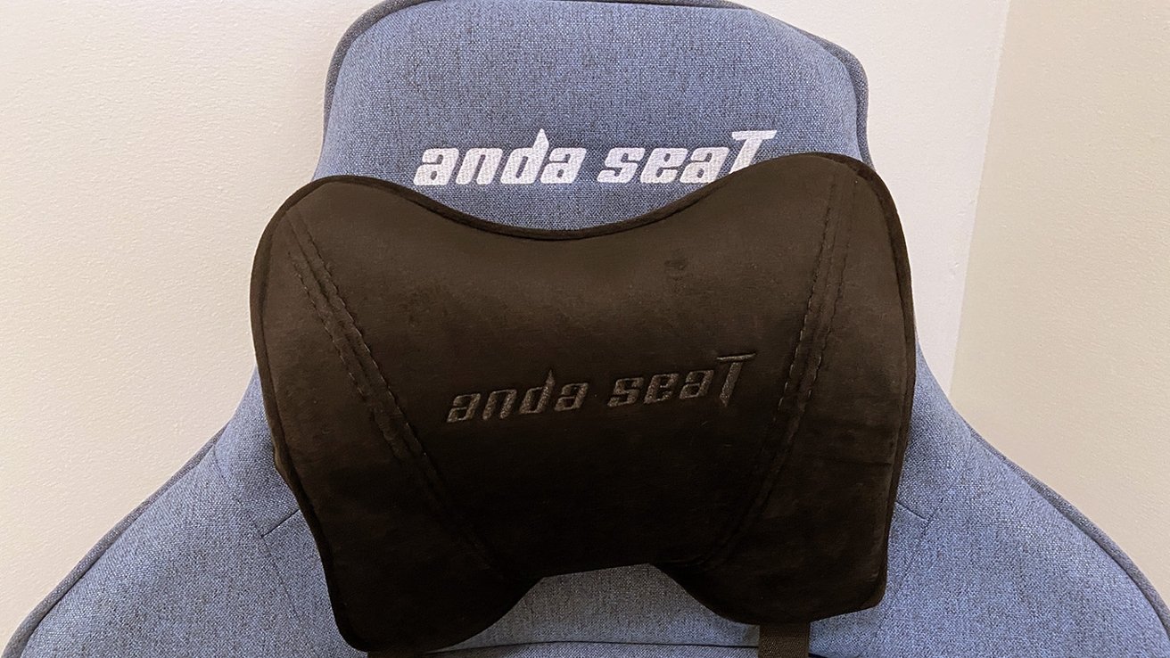 The head and lumbar pillows are covered in a soft, faux-suede material