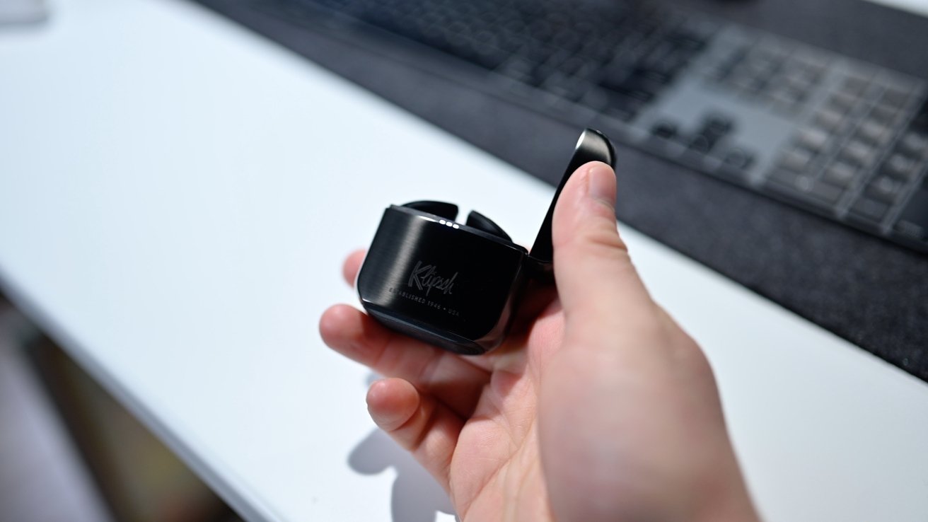 Klipsch's case uses a sideways-flipping lid, similar to a Zippo lighter.