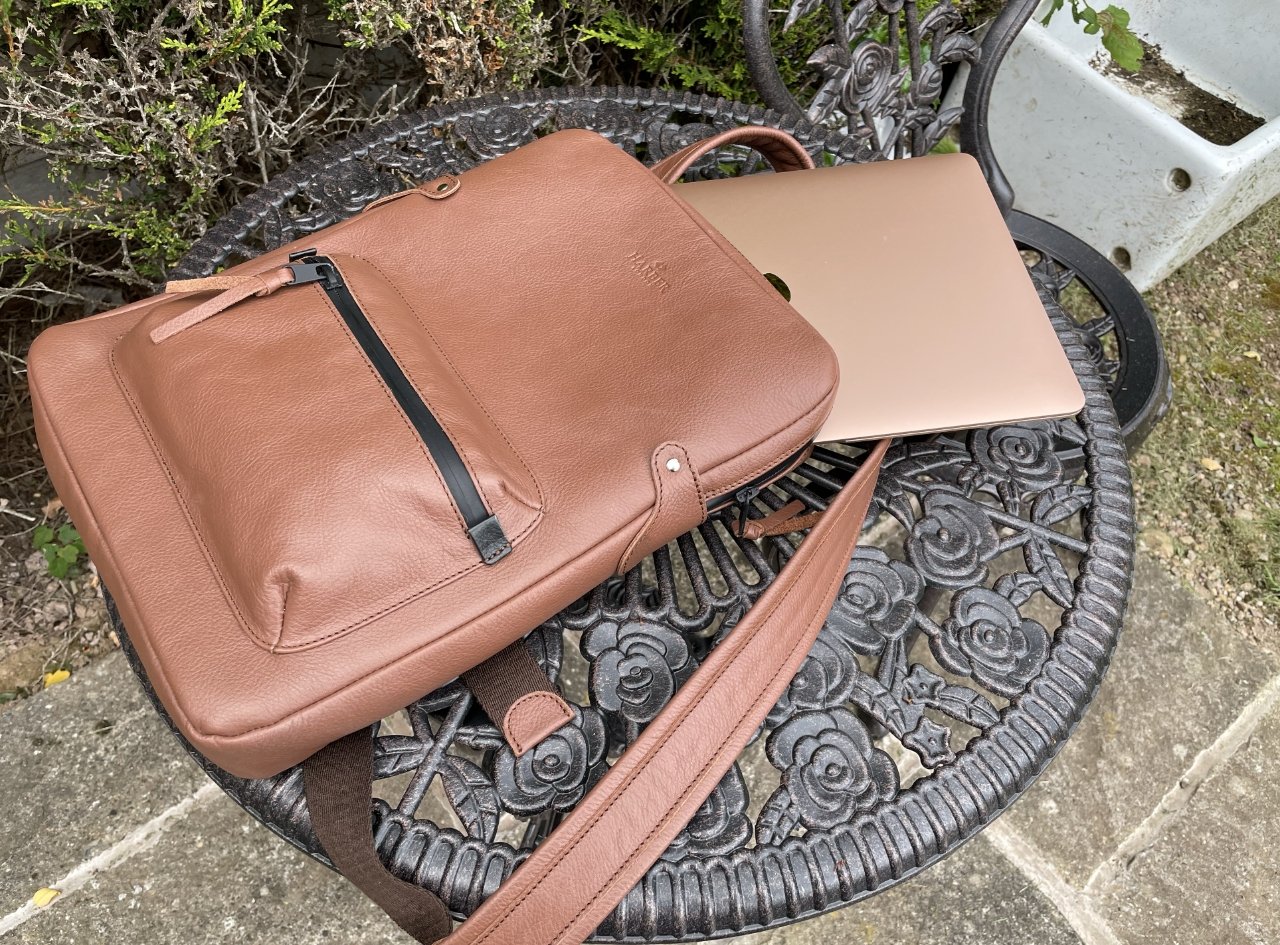 This medium size backpack neatly holds a 13-inch MacBook Air (pictured) or MacBook Pro